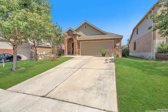 view of front of home featuring a front lawn and a garage