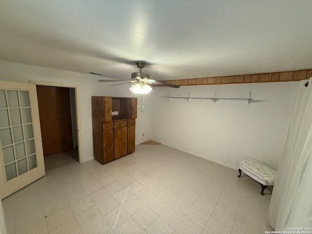 unfurnished bedroom featuring ceiling fan