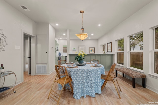 dining space featuring light hardwood / wood-style flooring