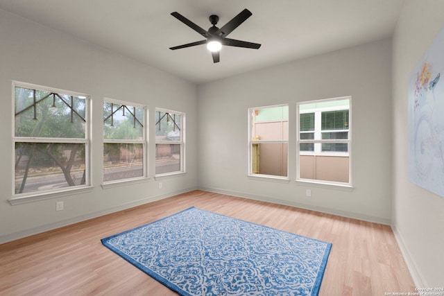 unfurnished room featuring ceiling fan and light hardwood / wood-style flooring