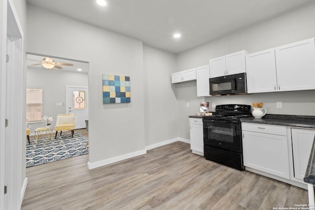 kitchen with white cabinetry, light hardwood / wood-style floors, black appliances, and ceiling fan