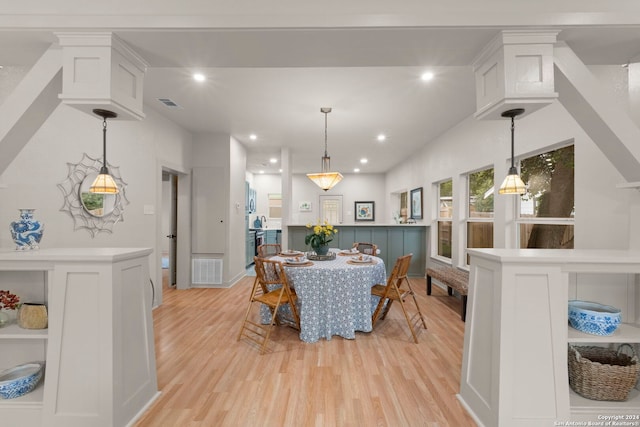 dining area with light hardwood / wood-style floors