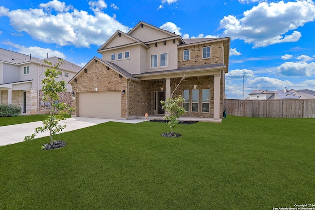 view of front of house with a garage and a front lawn