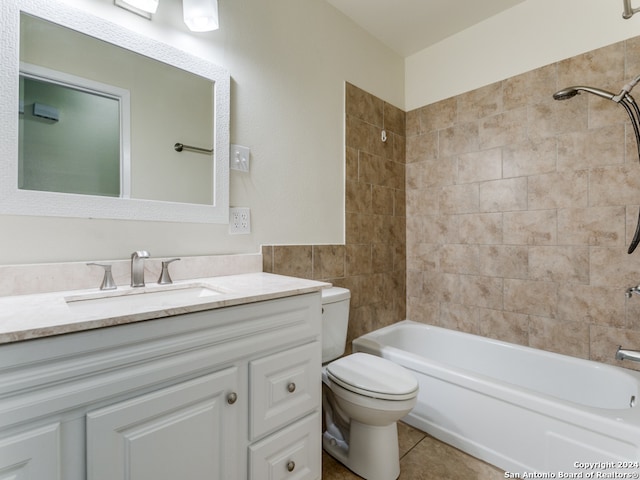 full bathroom with toilet, tiled shower / bath combo, vanity, and tile patterned flooring