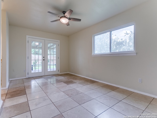 unfurnished room with french doors, ceiling fan, and light tile patterned flooring