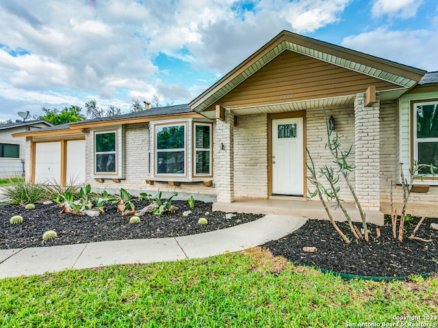 single story home with a garage