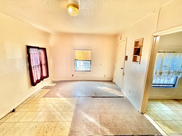 entryway featuring a textured ceiling