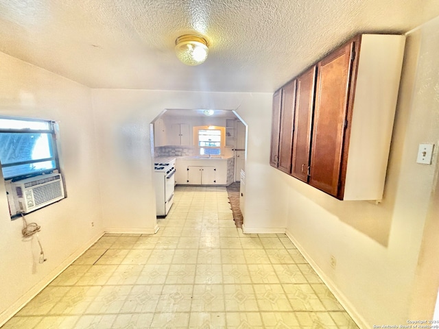 bonus room with a textured ceiling and cooling unit