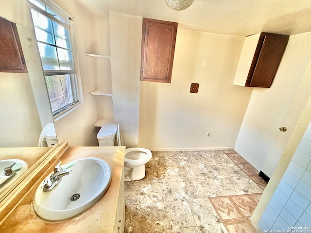 bathroom featuring vanity and toilet