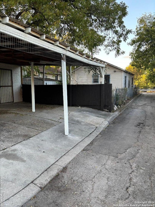 exterior space with a carport