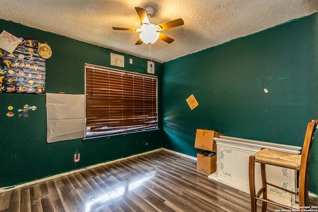 unfurnished bedroom featuring a textured ceiling, hardwood / wood-style flooring, and ceiling fan