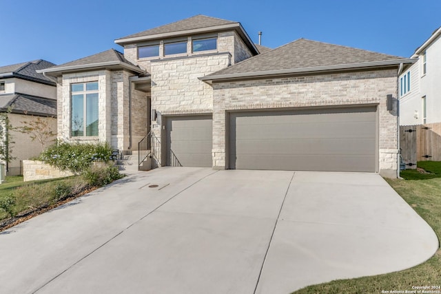 216 Paint Crk, Boerne, TX 78006 - view of front facade with driveway, a garage, stone siding, and roof with shingles