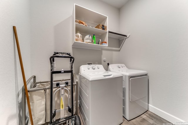 216 Paint Crk, Boerne, TX 78006 - washroom with separate washer and dryer, light wood-style flooring, and baseboards