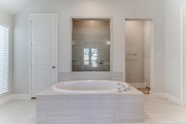216 Paint Crk, Boerne, TX 78006 - full bath with a bath, baseboards, tiled shower, and lofted ceiling
