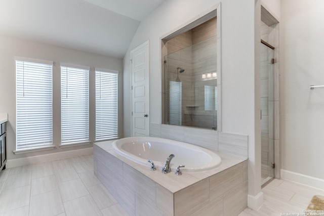 216 Paint Crk, Boerne, TX 78006 - bathroom featuring a garden tub, a stall shower, baseboards, vaulted ceiling, and vanity