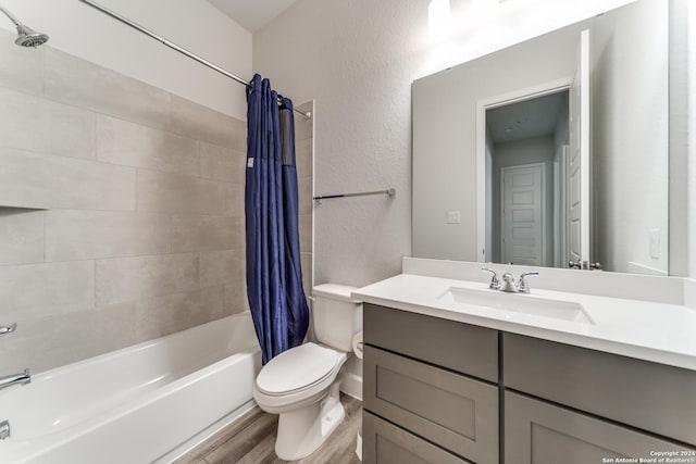 216 Paint Crk, Boerne, TX 78006 - bathroom with wood finished floors, toilet, shower / bath combo, and vanity