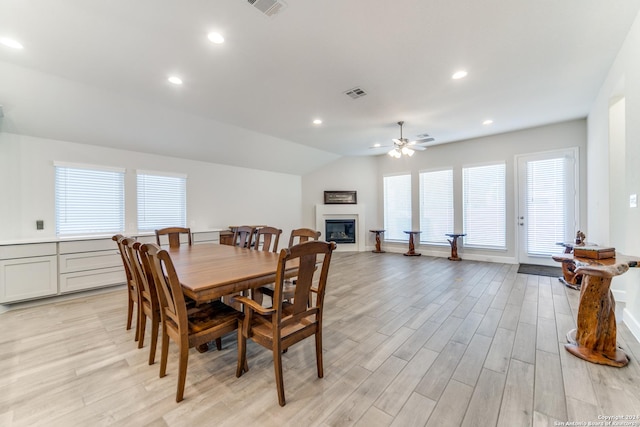 216 Paint Crk, Boerne, TX 78006 - dining space featuring a ceiling fan, light wood-style floors, a glass covered fireplace, recessed lighting, and lofted ceiling