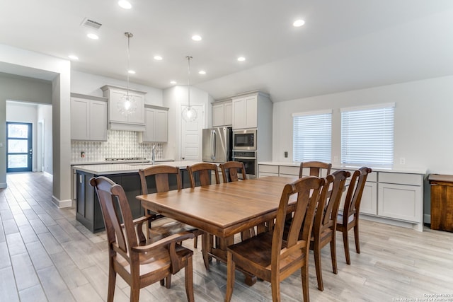 216 Paint Crk, Boerne, TX 78006 - dining area with light wood-style flooring and recessed lighting