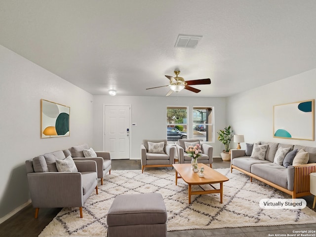 living room featuring light hardwood / wood-style flooring and ceiling fan