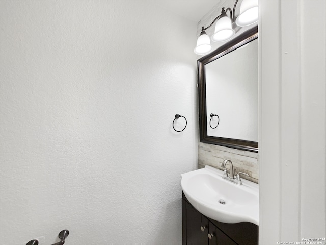 bathroom with vanity and backsplash