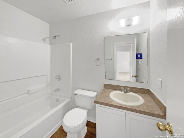 full bathroom featuring vanity, toilet, tub / shower combination, and wood-type flooring