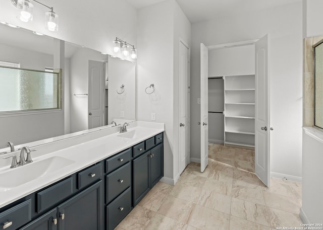 bathroom featuring vanity and an enclosed shower