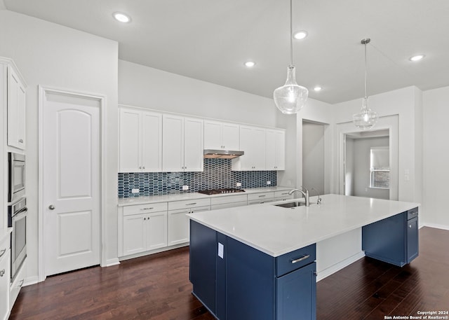 kitchen featuring an island with sink, white cabinets, and dark hardwood / wood-style flooring