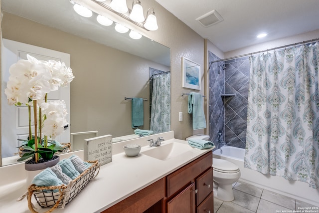 full bathroom featuring toilet, vanity, shower / bath combo with shower curtain, and tile patterned floors