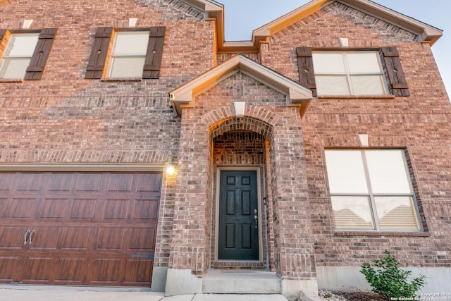 doorway to property featuring a garage