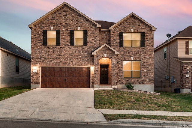 front facade with a garage