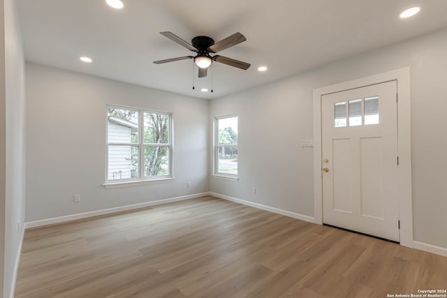 entryway with ceiling fan and light wood-type flooring