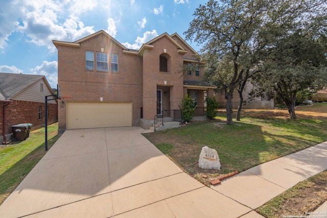 view of front of house with a garage and a front yard