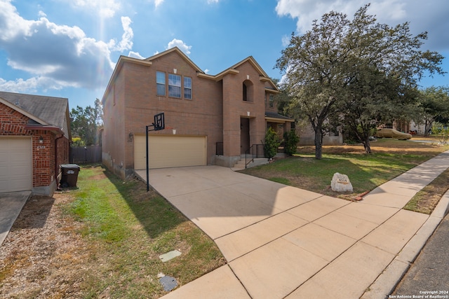 view of front facade featuring a garage and a front yard