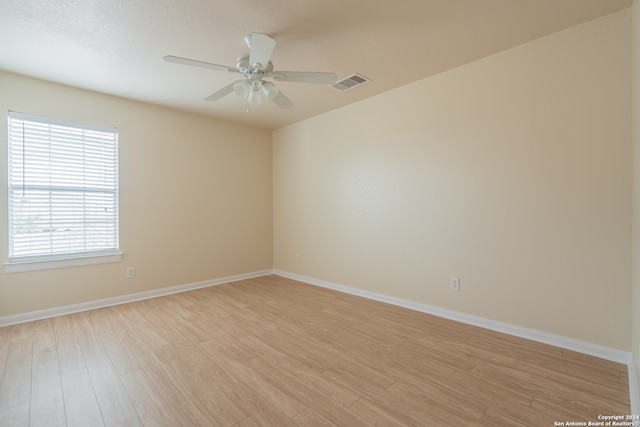 unfurnished room featuring ceiling fan and light wood-type flooring