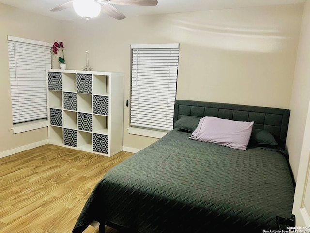 bedroom featuring hardwood / wood-style floors and ceiling fan