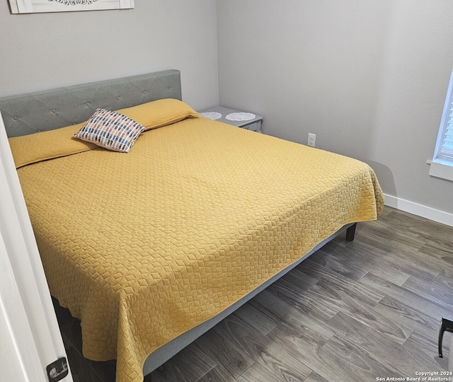 bedroom featuring wood-type flooring