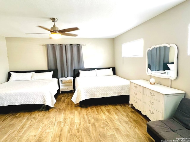 bedroom featuring light hardwood / wood-style floors and ceiling fan