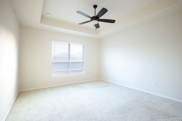 7270 Lunar Eclipse, Converse, TX 78109 - unfurnished room featuring carpet, a tray ceiling, baseboards, and a ceiling fan
