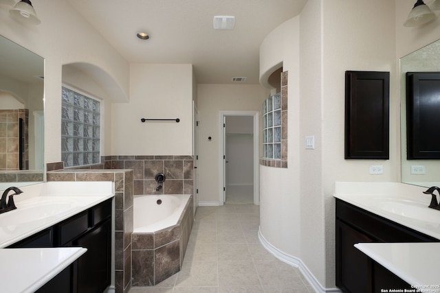 7270 Lunar Eclipse, Converse, TX 78109 - full bathroom with a garden tub, tile patterned floors, baseboards, and two vanities