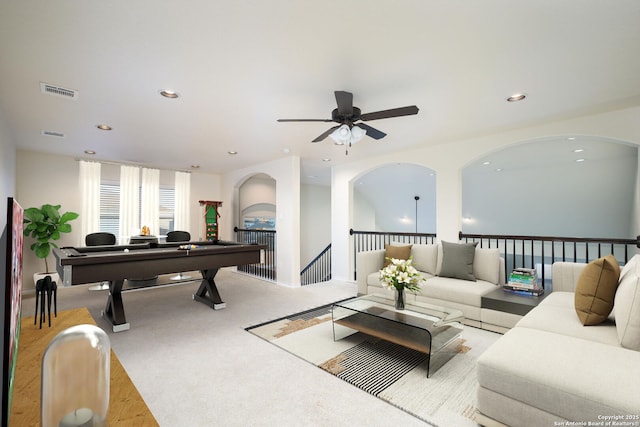 carpeted living room featuring ceiling fan and billiards