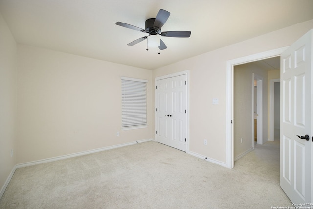 unfurnished bedroom featuring a closet, light carpet, and ceiling fan