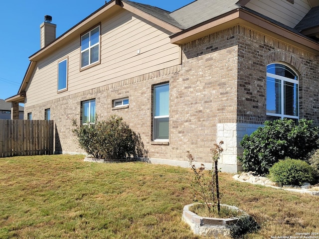 7270 Lunar Eclipse, Converse, TX 78109 - view of side of property with brick siding and a chimney