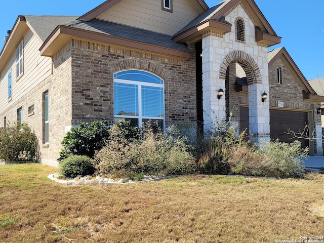 7270 Lunar Eclipse, Converse, TX 78109 - french country style house featuring brick siding, a garage, a front lawn, and a shingled roof