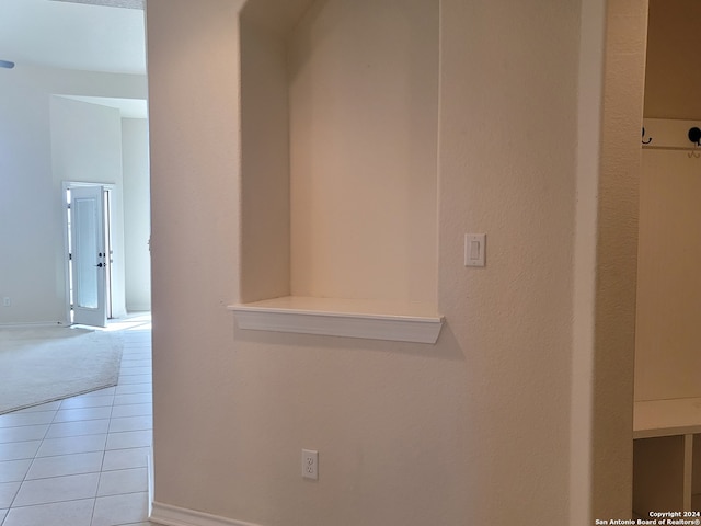 hallway with light tile patterned floors