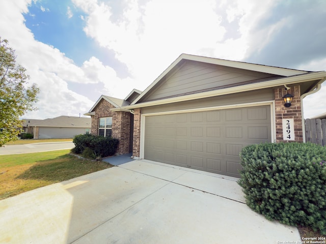 ranch-style house featuring a garage