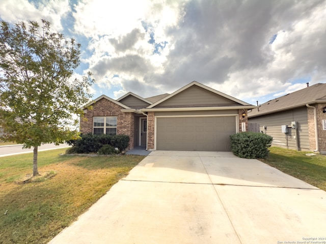 ranch-style home with a garage and a front lawn