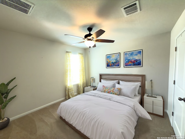 carpeted bedroom with ceiling fan