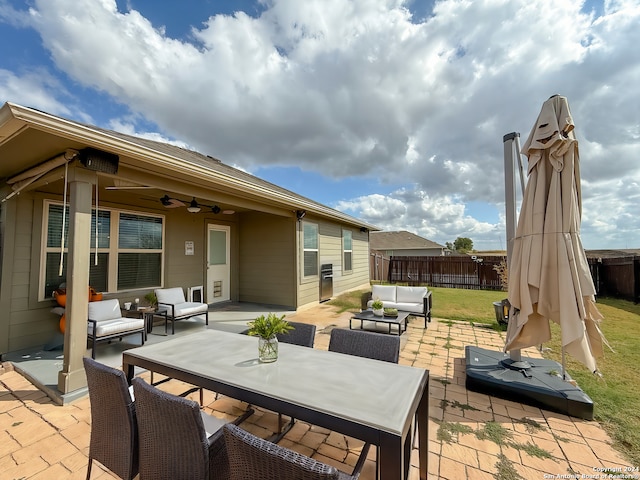 view of patio with ceiling fan and an outdoor hangout area