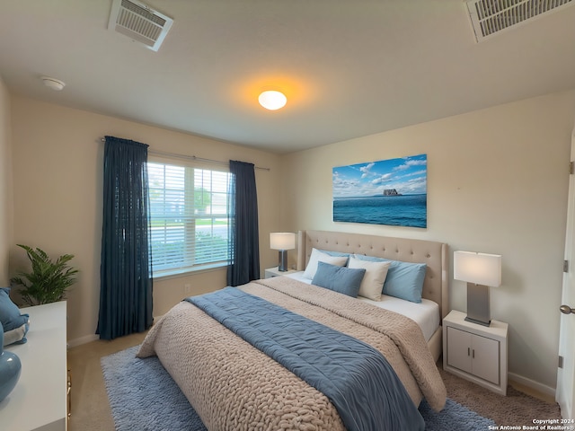 bedroom featuring light colored carpet