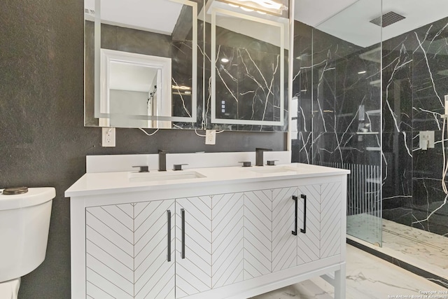 bathroom with walk in shower, vanity, and toilet